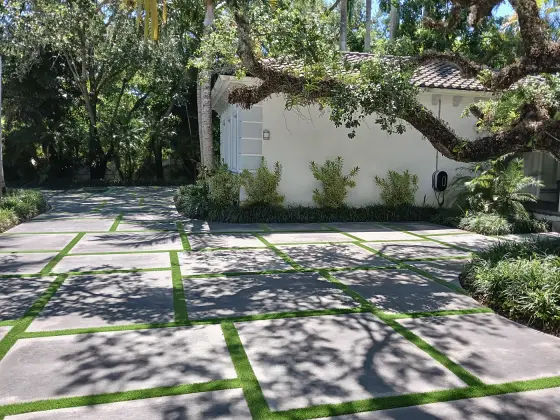 Shaded slab driveway with turf joints