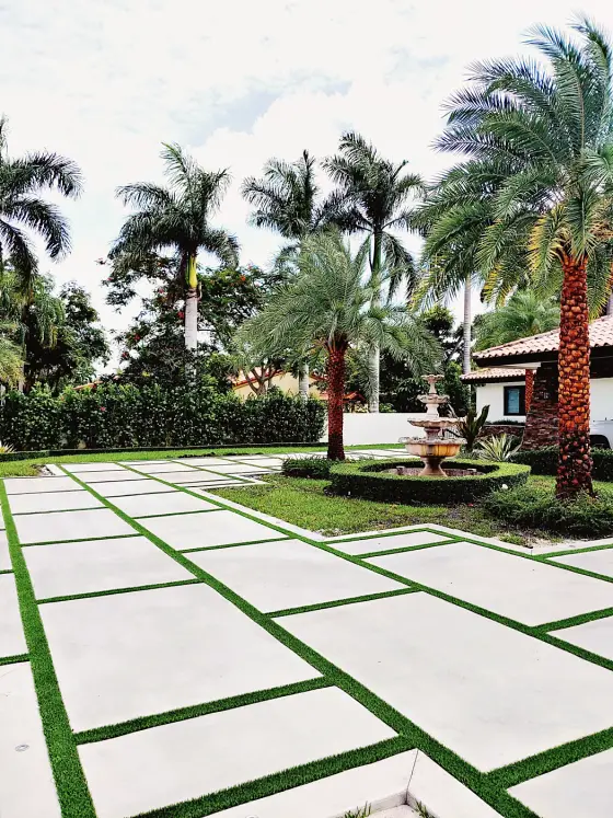 Slab drive with turf joints and fountain garden