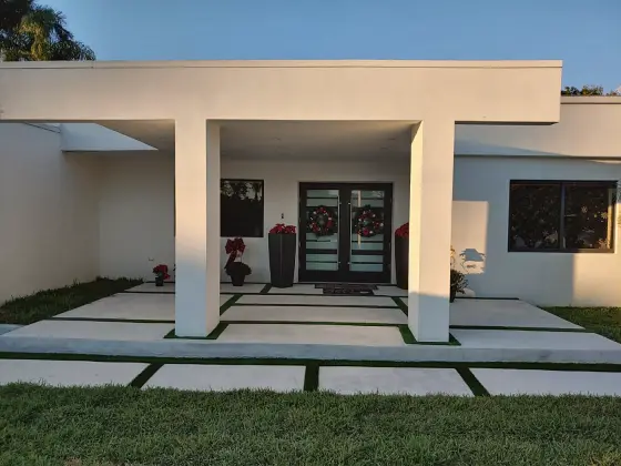 Covered front entry with slab paving