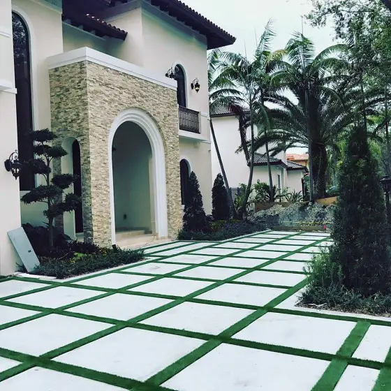 Turf-joint slab grid at a stone-arch entry
