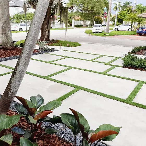 Corner-lot slab driveway with turf joints