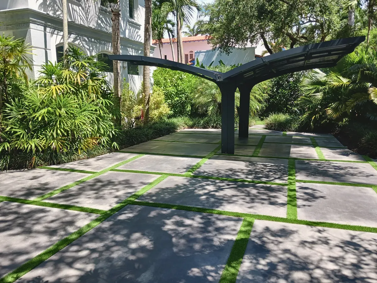 Concrete slabs with turf joints under a modern carport